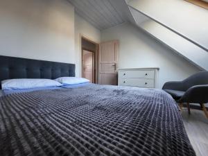 Postel nebo postele na pokoji v ubytování Gryf-Balt - Apartament