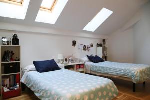 Ένα ή περισσότερα κρεβάτια σε δωμάτιο στο Hostel Palacio +4 φωτογραφίες