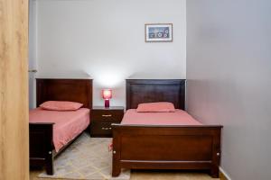 Postel nebo postele na pokoji v ubytování O'wErisa Homes
