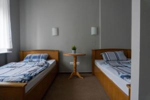 Łóżko lub łóżka w pokoju w obiekcie Ośrodek Wypoczynkowy Leśne Ustronie