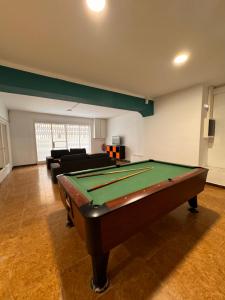a living room with a pool table in it at Hostal San Carlos in Lloret de Mar