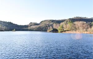 a view of a large lake with mountains in the background at Pet Friendly Home In Lyngdal in Lyngdal