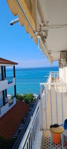 a balcony with a view of the ocean at beach apartment in Pefkohori