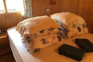 two pillows on a bed in a room at The Golden Circle Cabin in Selfoss