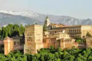 a large building with a tower on top of it at Evaleta 2, precioso apartamento recién estrenado in Monachil