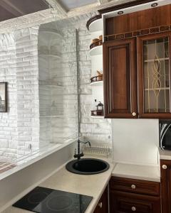 a kitchen with a sink and a counter top at VIP apartments ! in Lviv +45 photos