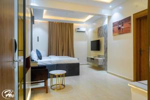 TV a/nebo společenská místnost v ubytování Hadmof Hotel and Suites