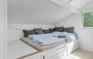 a bed in a white room with a window at Beautiful Home In Odder With Wifi in Odder
