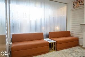 Posezení v ubytování Hadmof Hotel and Suites
