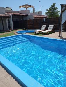 The swimming pool at or close to Villa Red Porto Cheli