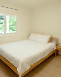 Soomhouse客房内的一张或多张床位