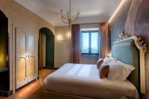 a bedroom with a large bed and a window at San Francesco al Monte in Naples