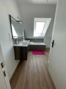 a bathroom with a sink and a mirror at Maison 5 chambres sortie saint malo in Saint-Méloir-des-Ondes +19 photos
