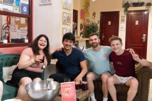 a group of people sitting in a room at Home Youth Hostel by Feetup Hostels in Valencia +148 photos