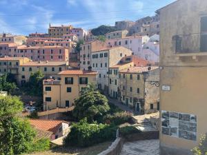 a view of a city with buildings at Villa Il Guardingo in Rio nellʼElba