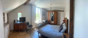 a bedroom with a bed and a dresser and a desk at 21 in Melun