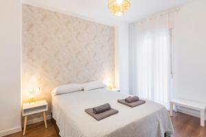 Posteľ alebo postele v izbe v ubytovaní LU&CIA LA SIESTA