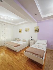 Postel nebo postele na pokoji v ubytování Apartments Lucerna