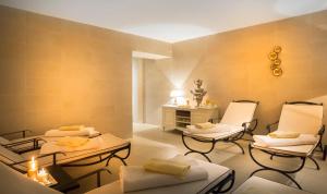 a spa room with two chairs and a table at Hotel Kvarner - Liburnia in Opatija