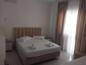 Postel nebo postele na pokoji v ubytování Hotel Ani