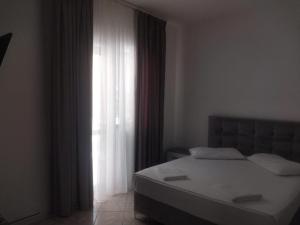 Postel nebo postele na pokoji v ubytování Hotel Ani