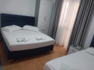 Postel nebo postele na pokoji v ubytování Hotel Ani