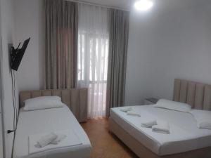 Postel nebo postele na pokoji v ubytování Hotel Ani