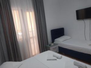 Postel nebo postele na pokoji v ubytování Hotel Ani