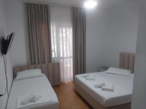 Postel nebo postele na pokoji v ubytování Hotel Ani