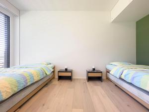 Rúm í herbergi á Auberge de Jeunesse Val-de-Travers