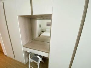 a small bedroom with a bed and a mirror at Yas Island Mayan 2 Junior 1 Bed Apartment by Central Stay in Abu Dhabi +26 photos