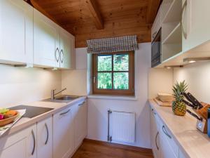 Kuchyň nebo kuchyňský kout v ubytování Das Chalet Kleines Appartement mit Garten - by NV-Appartements + 5 fotografií
