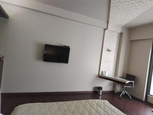TV a/nebo společenská místnost v ubytování Park Prime Kolkata