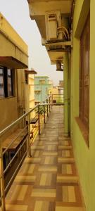 an empty corridor of a building with a balcony at CHETAN INN HOTEL in Bhubaneshwar
