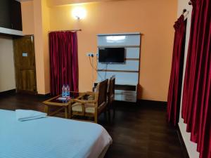 Μια τηλεόραση ή/και κέντρο ψυχαγωγίας στο CHETAN INN HOTEL