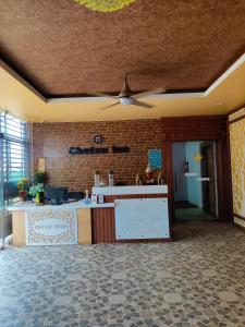 a kitchen with a counter in a room with a ceiling at CHETAN INN HOTEL in Bhubaneshwar