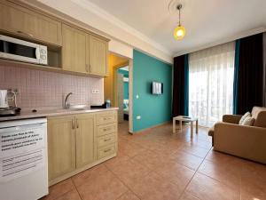 A kitchen or kitchenette at Villa Dolunay Apart Hotel