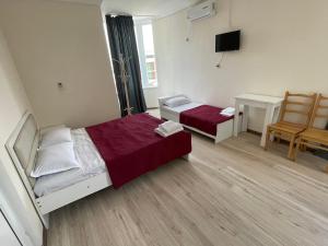 Voodi või voodid majutusasutuse Barakat Hotel toas