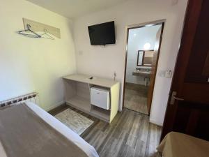 Cama ou camas em um quarto em Pousada Rosa