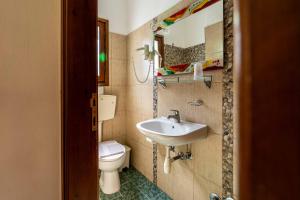 a bathroom with a sink and a toilet at Guesthouse Papachristou in Tsagarada +76 photos