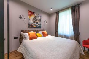 Ένα ή περισσότερα κρεβάτια σε δωμάτιο στο Central apartment with a swimming pool +22 φωτογραφίες