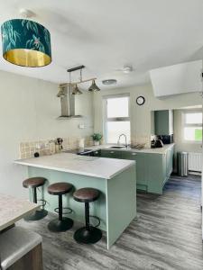 Kuchyň nebo kuchyňský kout v ubytování Hollycombe