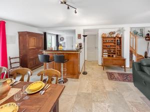 a living room with a table and a couch at Nature et Bord d'Etang à Jars in Jars