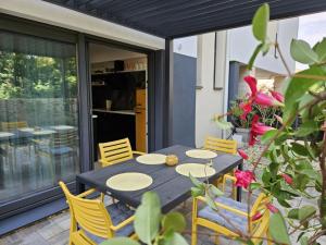a black table and chairs on a patio at Grifone in Zadar