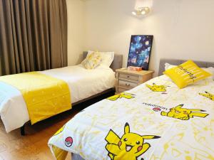 Postel nebo postele na pokoji v ubytování 颯House5