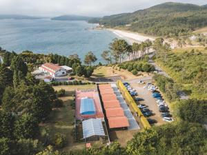 an aerial view of a parking lot next to a beach at Camping LagoMar in Muxia
