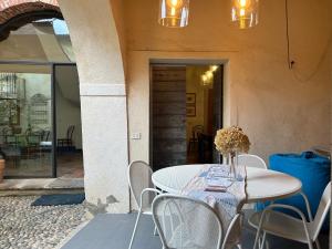 a white table and chairs on a patio at Casa Stella in Ameno