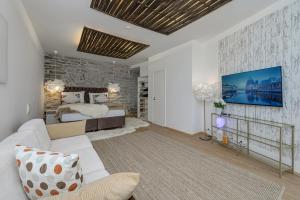 a living room with a bed and a couch at Tallinn Old Town Romantic Apartment in Tallinn