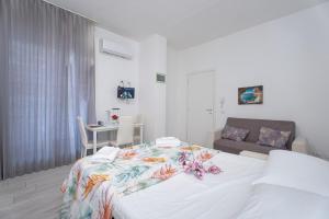 Ένα ή περισσότερα κρεβάτια σε δωμάτιο στο APARTMENTS VISTALLIHOUSE