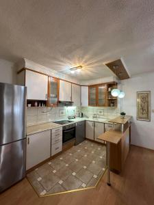 Kuchyň nebo kuchyňský kout v ubytování Meri Apartments